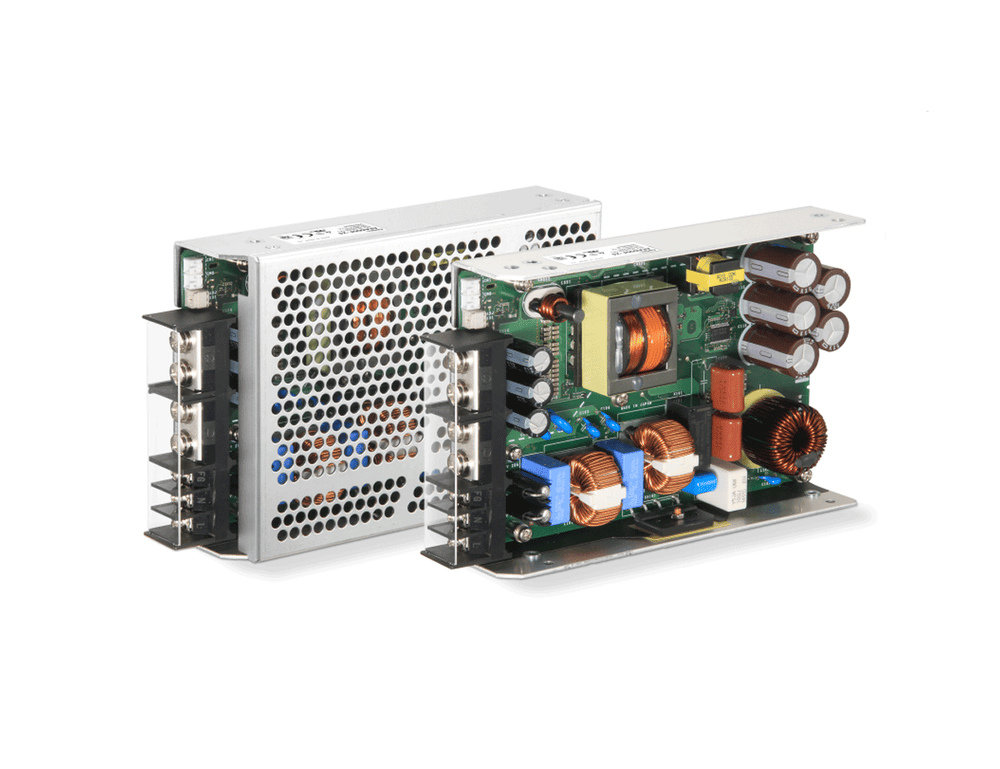 Cosel AEA600F 600W AC-DC power supply shown covered and open-frame, exposing transformer, coils and capacitors.